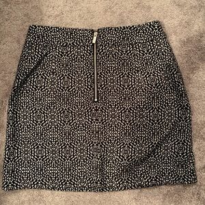 Black and white skirt with cute gold zipper.